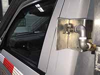 Red door gel crew protection system extendable spray nozzle